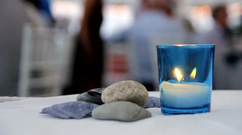 Candle flickering on table at party, close up Stock Footage 34860201