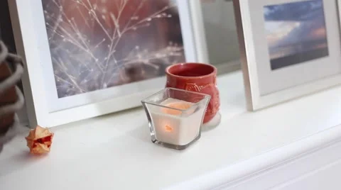 Candle flickers in the breeze Stock Footage 64221570