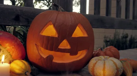 A Candle Flickers Inside a Halloween Jack O'Lantern Stock Footage 68930925