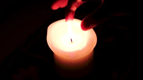 Candle gets put out by a hand Stock Footage 41578922