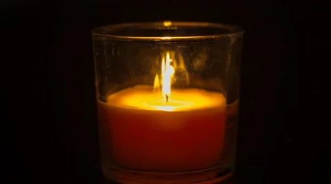 Candle in a glass burning Stock Footage 48598672