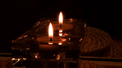 Candle in glass container with reflection Stockbeeldmateriaal 35486545