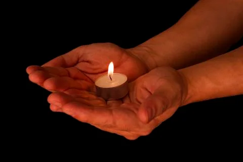 Candle in the hands Stock Photos