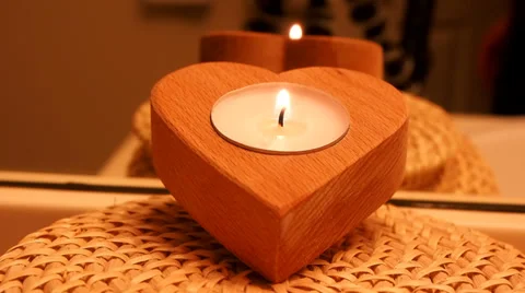 Candle in heart shaped container Stock Footage 35485087