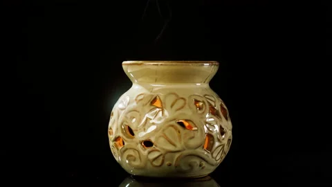 Candle holder close-up. Making aroma candles, oil diffuser on black background Video stock 166536483