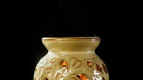 Candle holder close-up. Making aroma candles, oil diffuser on black background Video stock 166536536