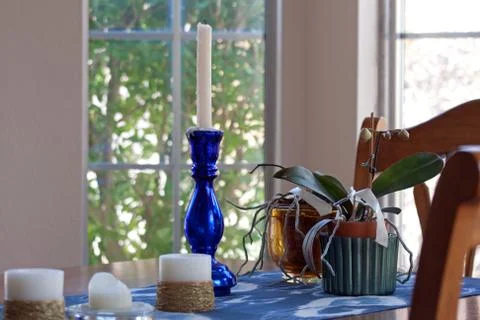 Candle holder on dining table Stock Photos