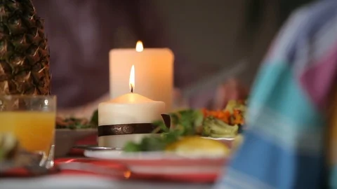 Candle on the holiday table Stock Footage 99791164