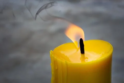 A candle is an ignitable wick embedded in wax, or another flammable solid sub Stock Photos