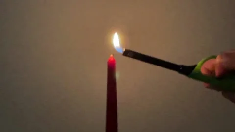 Candle ignition with gas lighter Stock Footage 221482656