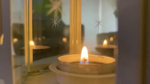 Candle inside a candleholder Stock Footage 142692831