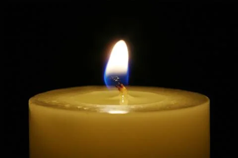 A candle isolated with black background Stock Photos