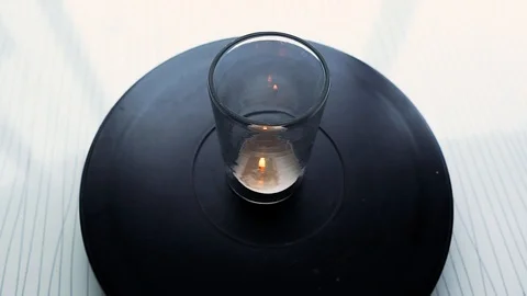 Candle in jar rotating on black background 스톡 동영상 113524272