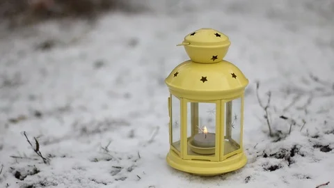 Candle lamp in the snow Stock Footage 107938492