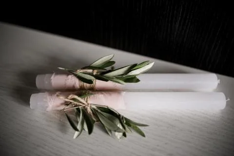 Candle with leaf decor on the table Stock Photos