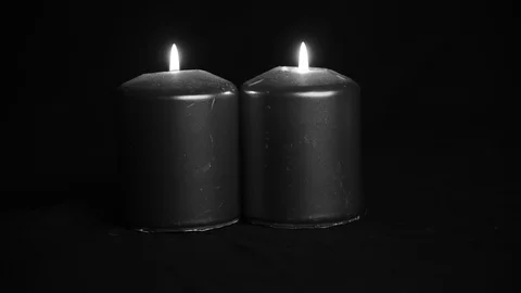 Candle light on black background Stock Footage 128568797