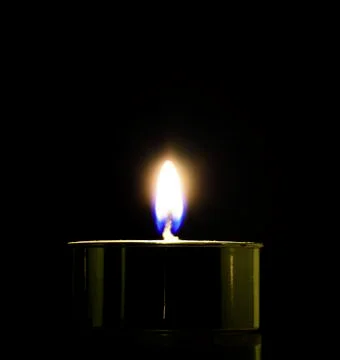Candle light on black background Stock Photos