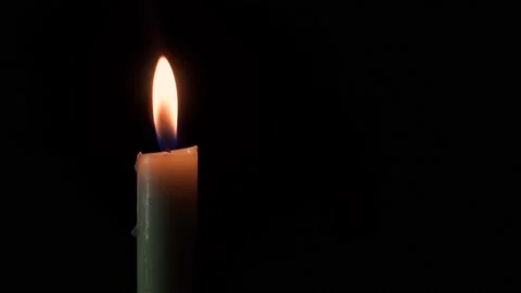 Candle light burning brightly in the black background. Stock Footage 167811697