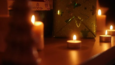 Candle Light on Christmas and a Present Package Stock Footage 179231100