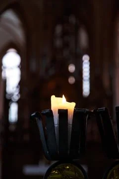 Candle Light on Dark Background Stock Photos