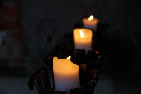 Candle Light on Dark Background Stock Photos