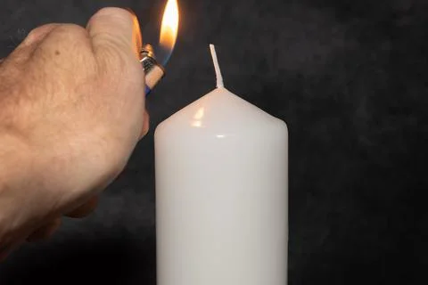 Candle light in the darkness Stock Photos