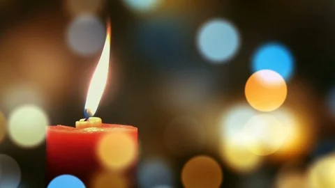 Candle light on defocused rotating bokeh background 動画素材 122036236