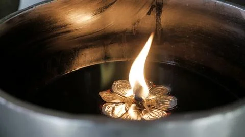 A candle light inside floating on water vessels Stock-Fotos