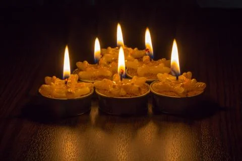 Candle-light with reflection of black background Stock Photos