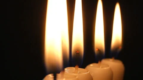 Candle light. A row of burning candles rotating. Stock Footage