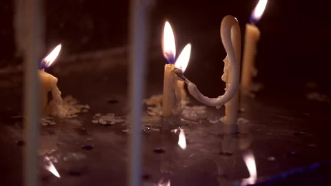 Candle light shines from behind large metal doors Stock Footage 331105440