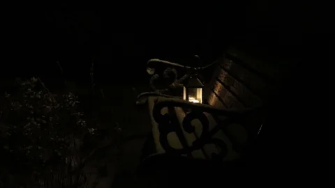 Candle light on snowy bench Stock Footage 86219516