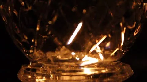 Candle light through cut glass Stock Footage 8906517