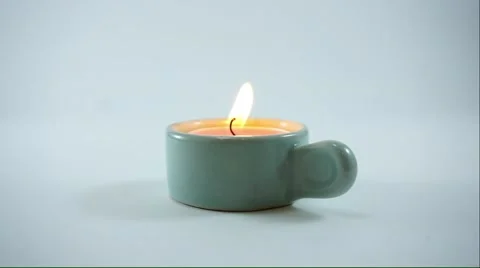 Candle lighting in ceramic holder Stock Footage 50154196