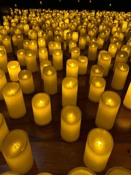 Candle Lighting in a Dark Environment Stock Photos