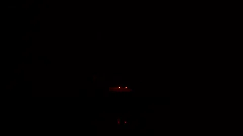 Candle lighting up in the dark inside the pot Video stock 160210857