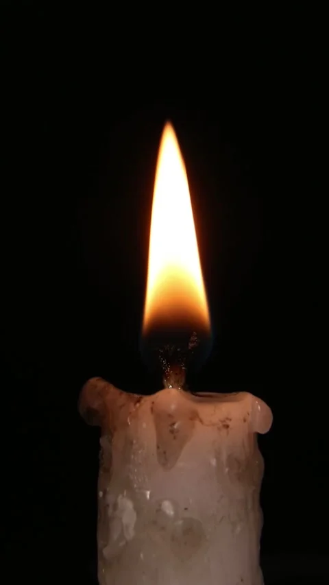 Candle Lighting Process and Steady Flame Against Dark Background Video stock 309853768