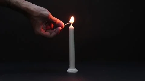 Candle Lightning with Match Stick in the dark background Stockbeeldmateriaal 134914937