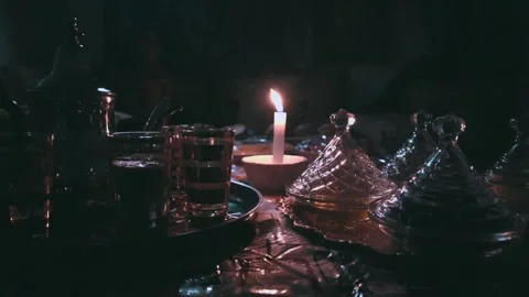 A candle lights the iftar table in Ramadan Video stock 303967619