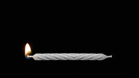 A candle is lit from both ends and burns towards the middle with black Video stock 266810614