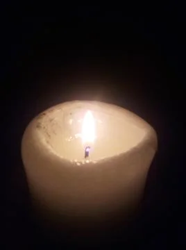 Candle Lit In Darkness 库存照片