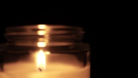 Candle Lit in Darkness with Soft Glow. 스톡 동영상 306858093