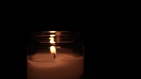 Candle Lit in Darkness with Soft Glow. 스톡 동영상 306858321