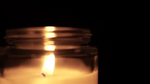 Candle Lit in Darkness with Soft Glow. Vídeo Stock 306858716