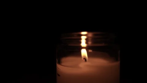 Candle Lit in Darkness with Soft Glow. 스톡 동영상 306858818