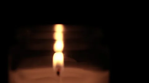 Candle Lit in Darkness with Soft Glow. 스톡 동영상 306859077