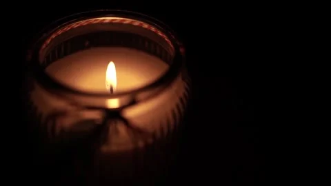 Candle Lit in Darkness with Soft Glow. 스톡 동영상 306859166