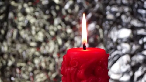The candle is lit, illuminating the background of the bokeh Stock Footage 337073194
