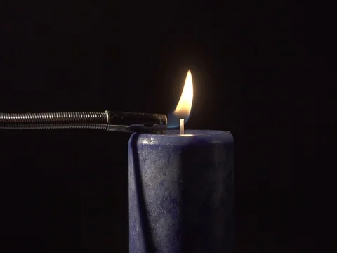 Candle lit by lighter 4K Stock Footage 77150805