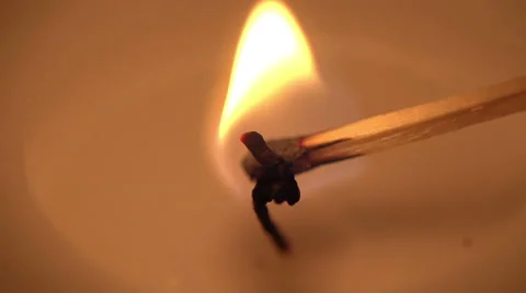 A candle is lit in slow motion Vídeo Stock 34653279